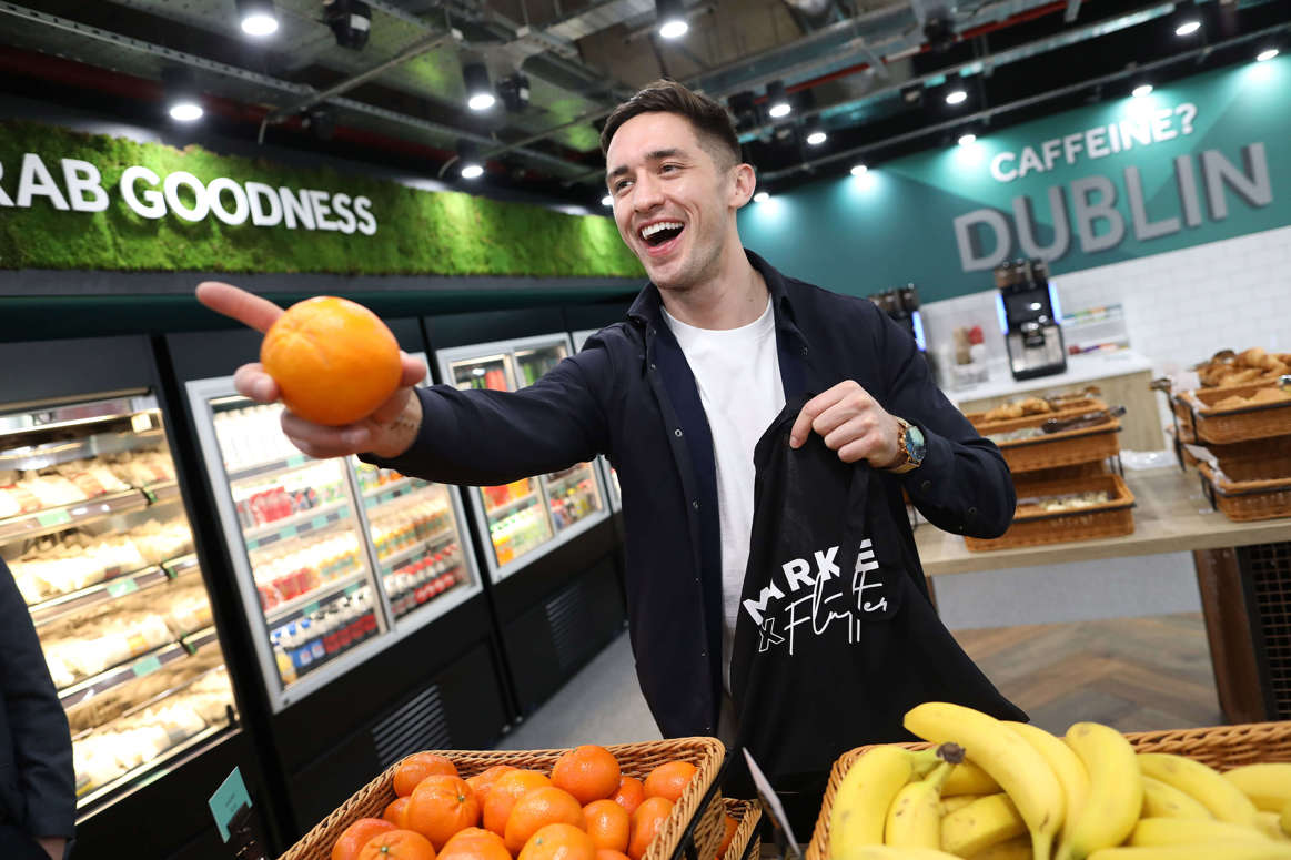 Market X with Greg O’Shea holding an orange