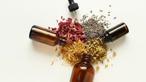 3 small glass jars, with dried petals and herbs