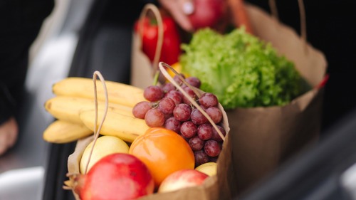 Fruit in brown paper bags